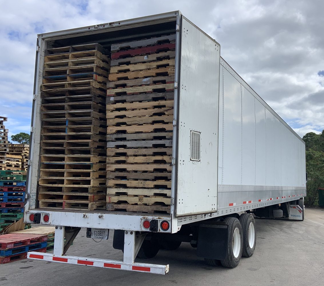 Drop trailer with pallets at yard